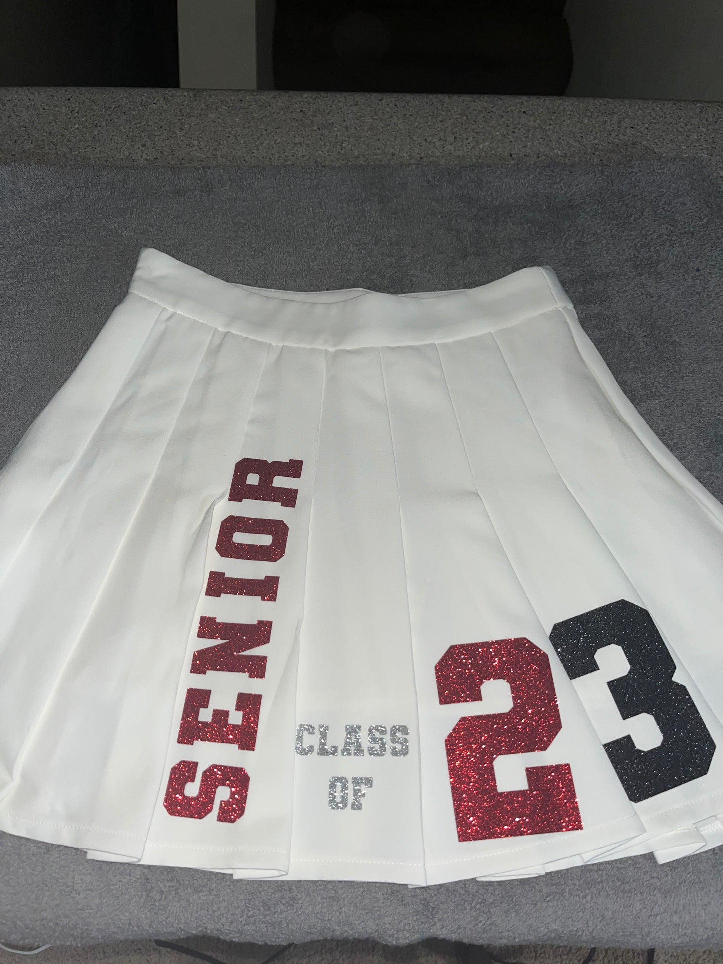 Custom graduation crew neck and pleated skirt